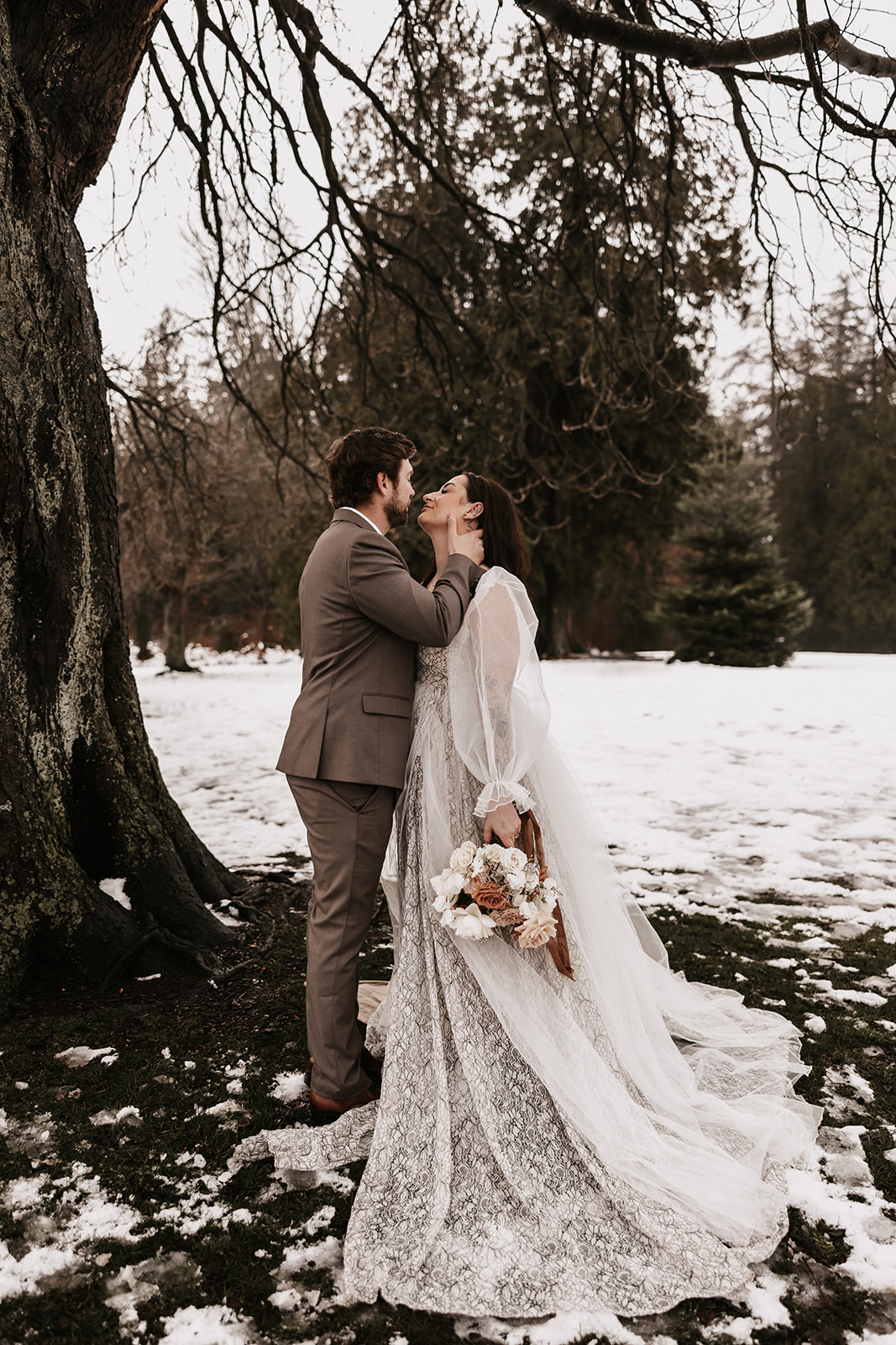 The couple shares a kiss surrounded by the dramatic urban landscape, symbolizing the unique charm of their Vancouver elopement.