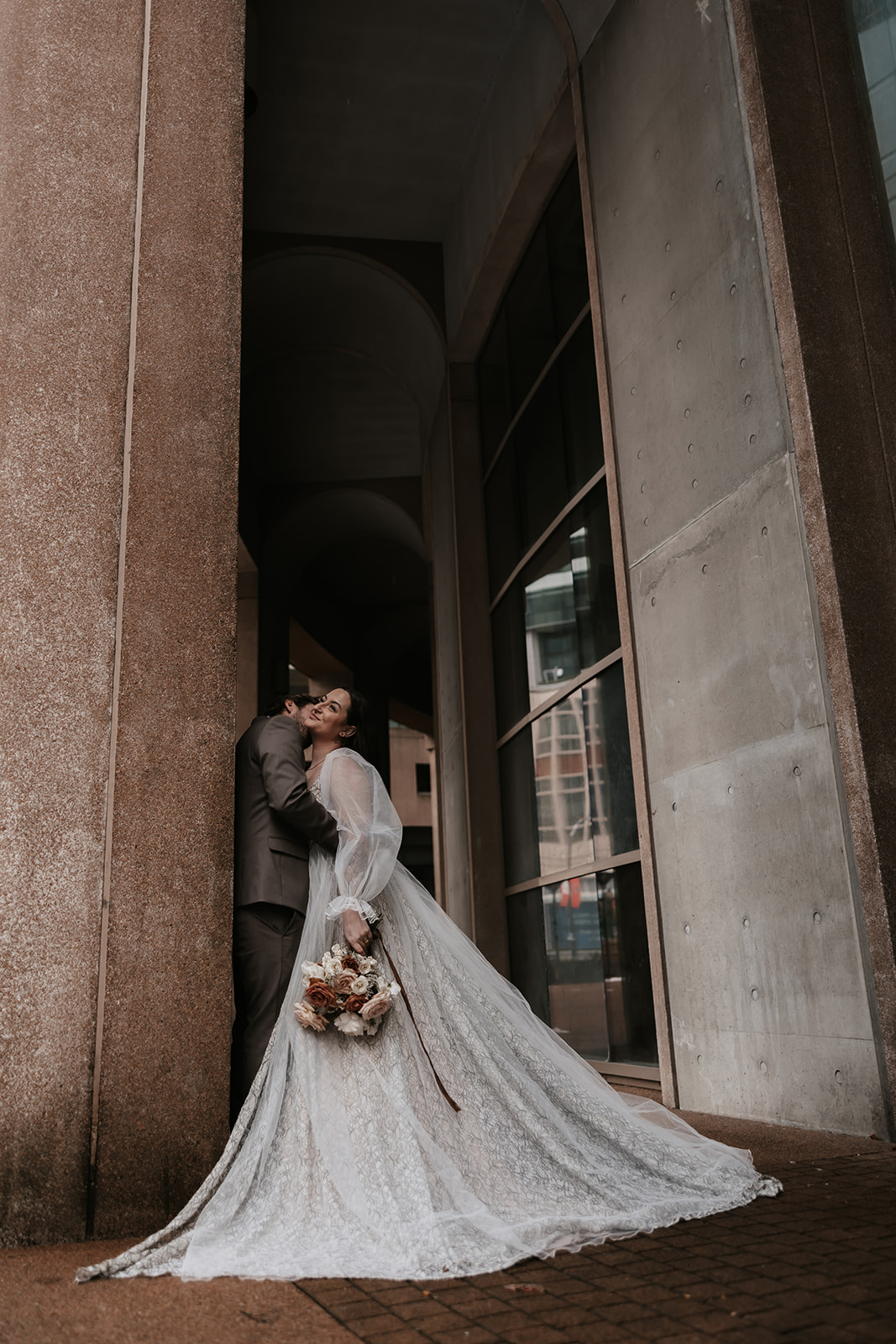 A close-up of the couple embracing joyfully during their Vancouver elopement, highlighting their connection.