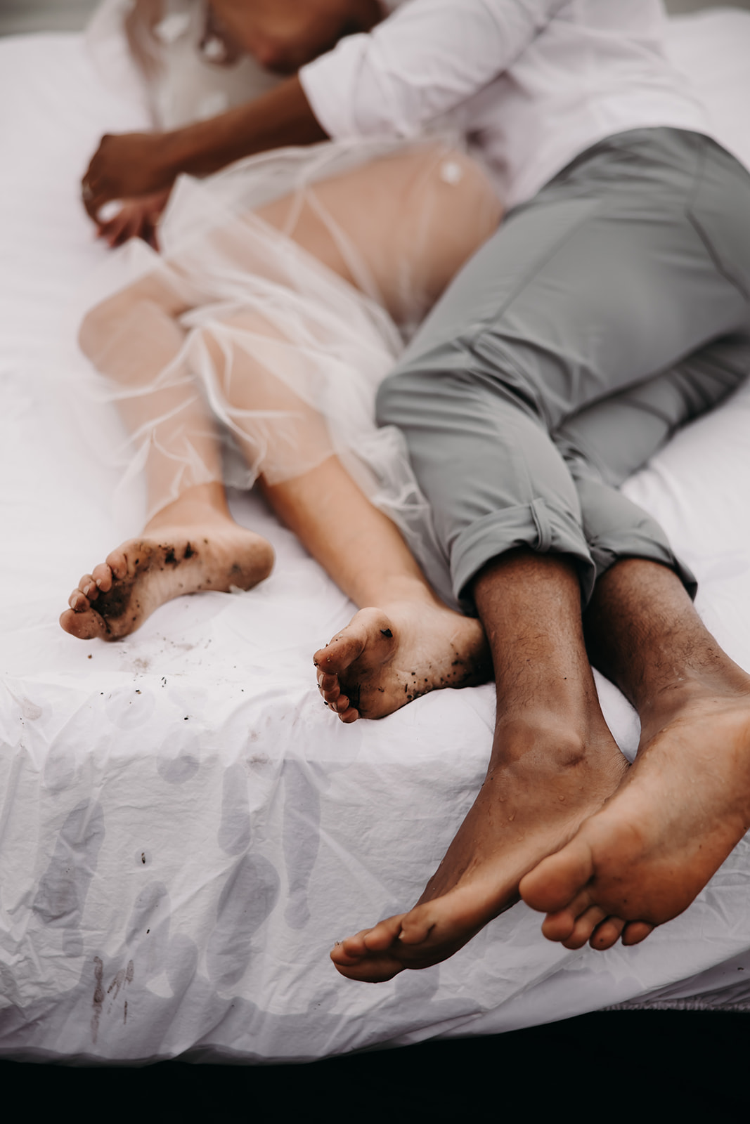 This unique engagement photo idea features the couple’s feet on a mattress in the water, adding an artistic touch to the photos with nature’s textures.