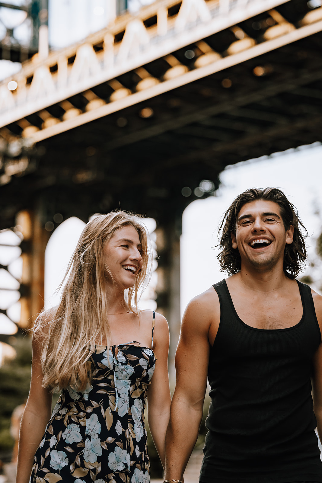 A close-up of the couple laughing together, their expressions full of joy, perfectly capturing the essence of their love during the photoshoot.

