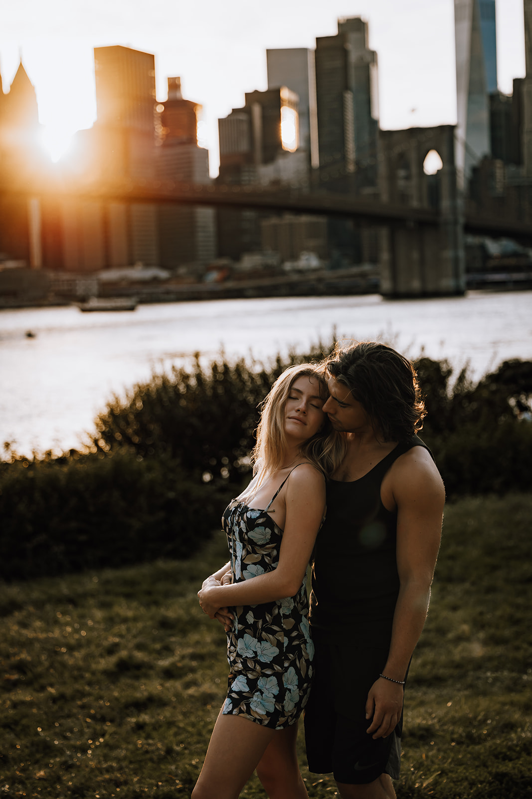 A candid moment of the couple gazing into each other’s eyes, capturing their connection against the stunning NYC skyline during their photoshoot.