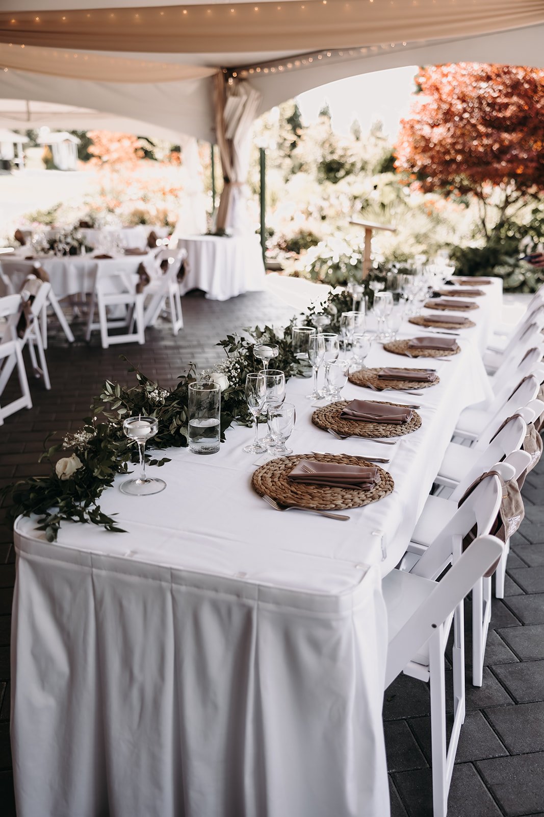 Table settings at the Redwoods Golf Course wedding venue, featuring elegant decor and floral arrangements.