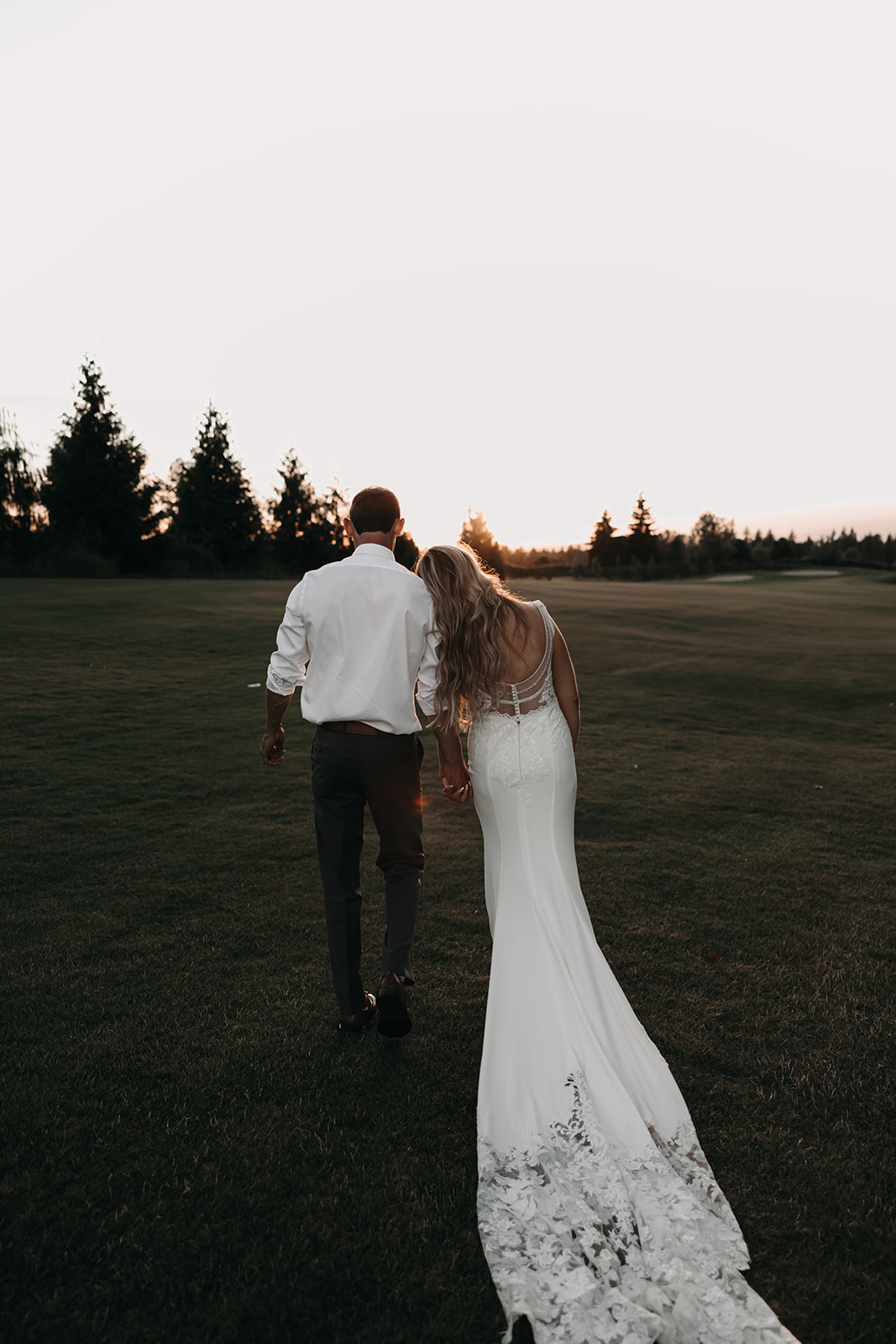 A sunset portrait of a couple at their Redwoods Golf Course wedding