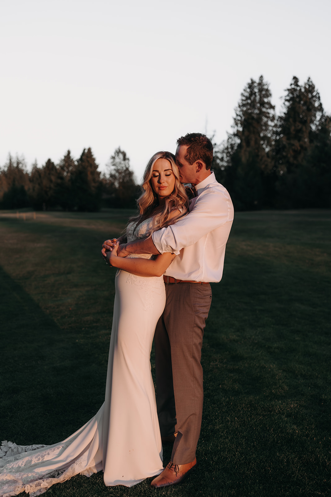 A sunset portrait of a couple at their Redwoods Golf Course wedding