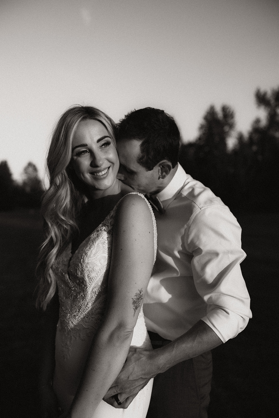 A sunset portrait of a couple at their Redwoods Golf Course wedding