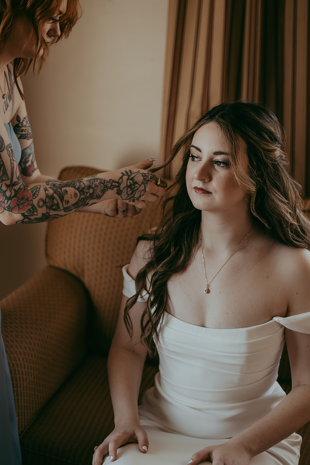 Bride getting her hair done for her intimate wedding in Maine