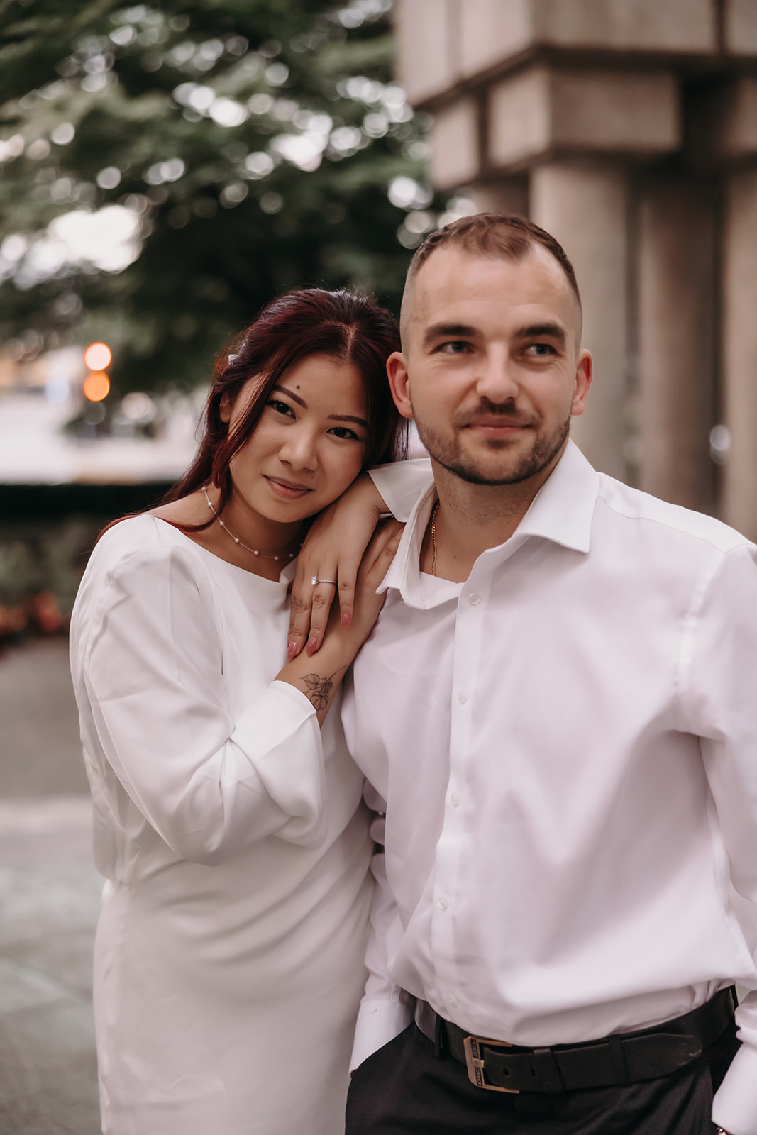 Couple posing for their city engagement photos