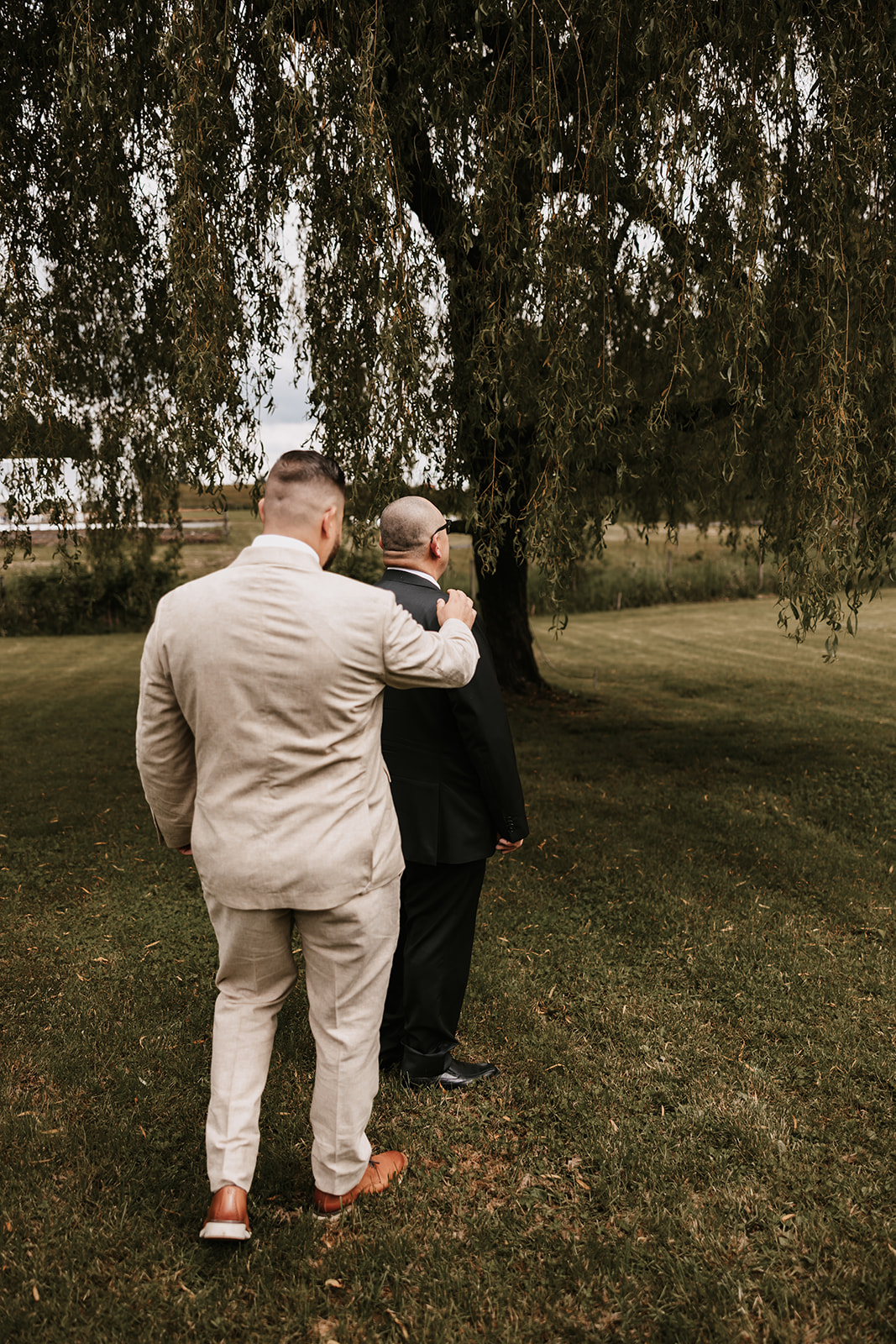 Groom and father of bride doing a first look as a joke