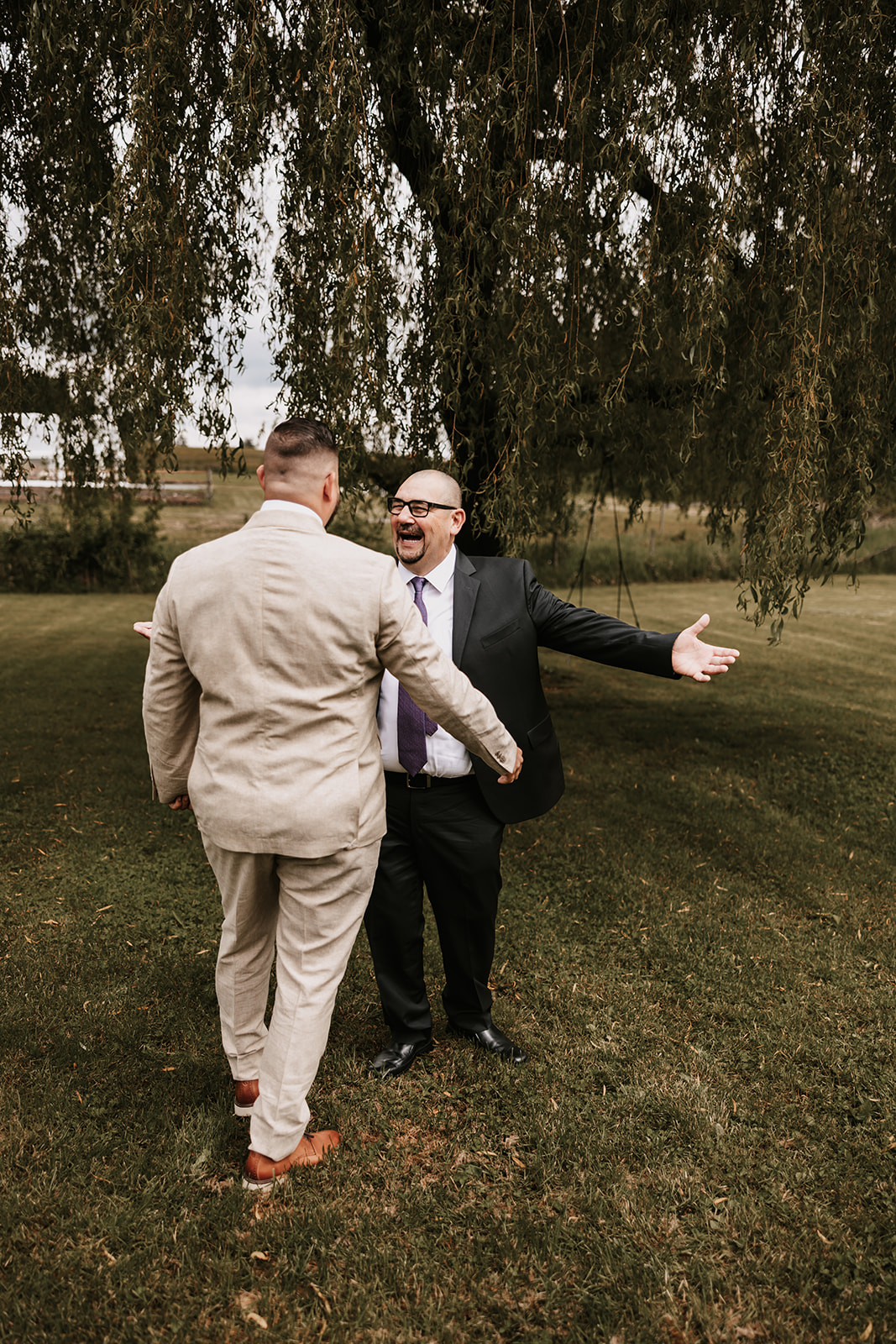 Groom and father of bride doing a first look as a joke