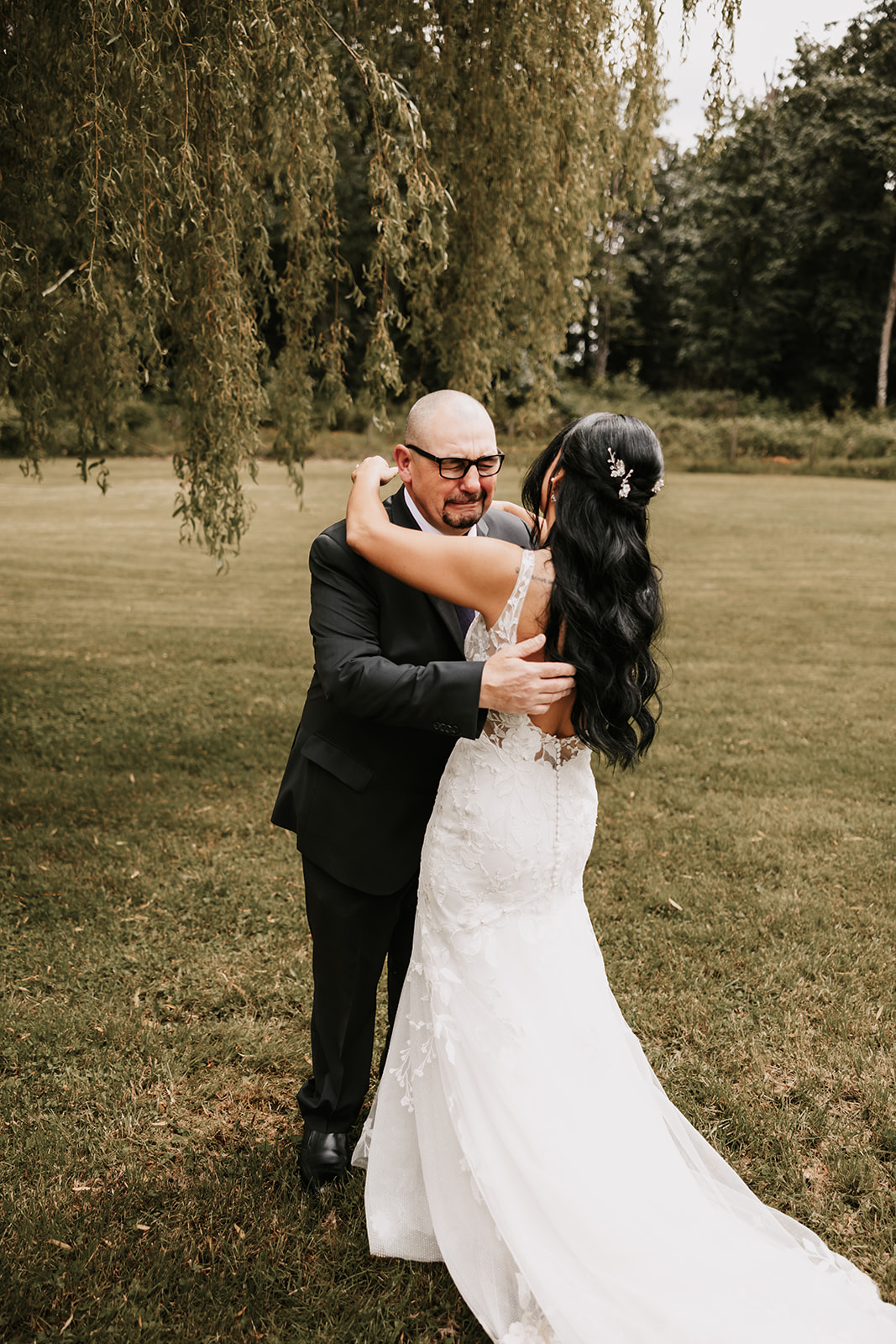 Brides father crying as he sees her for the first time