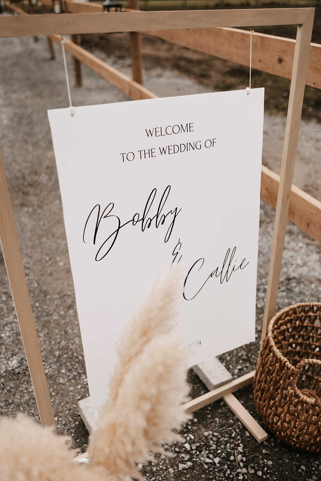 A beautiful welcome sign at a wedding, with the names of the couple, Bobby and Callie, welcoming guests. A simple and chic addition to the wedding that sets the tone for enjoying the day surrounded by loved ones.