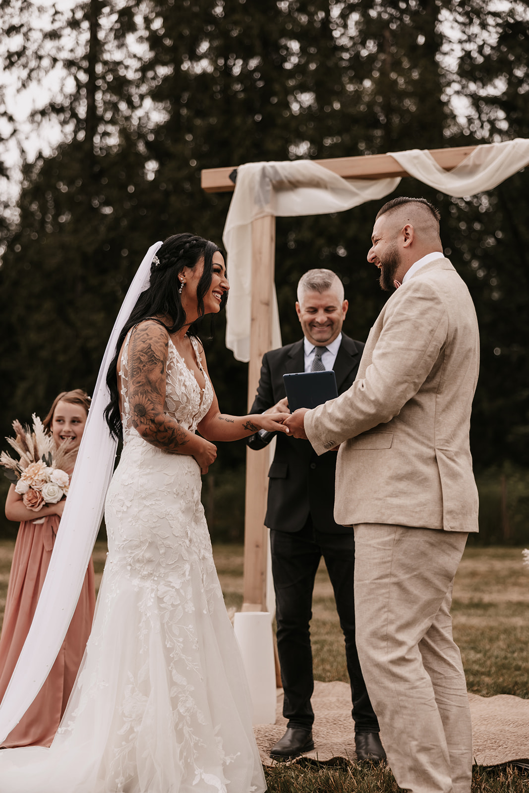 Bride and groom laughing as they exchange vows