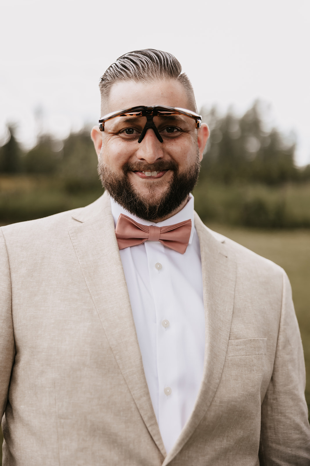 Groom acting silly making faces during his wedding