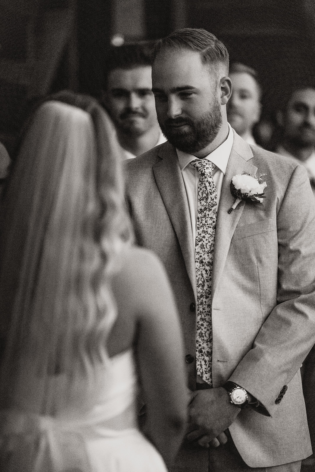 Bride and groom sharing an intimate moment at their wedding ceremony, highlighting the importance of embracing flexibility for a stress-free wedding day.