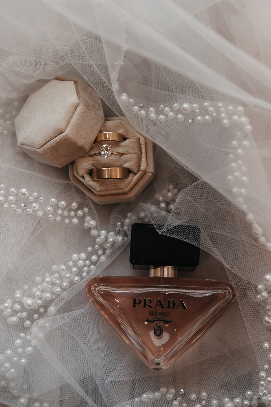 Bride wedding details of Prada perfume and wedding rings