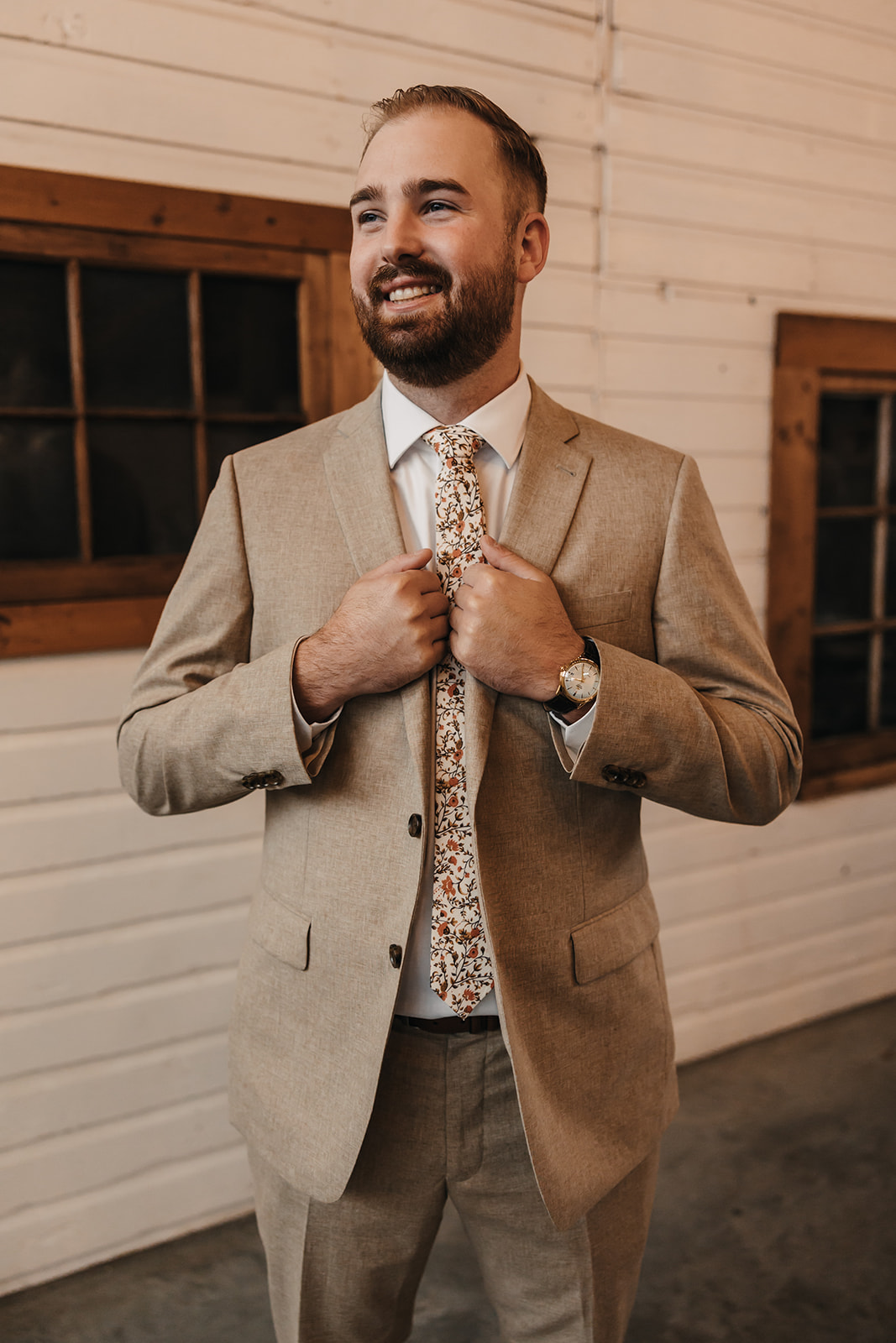 Groom in a tan wedding suite