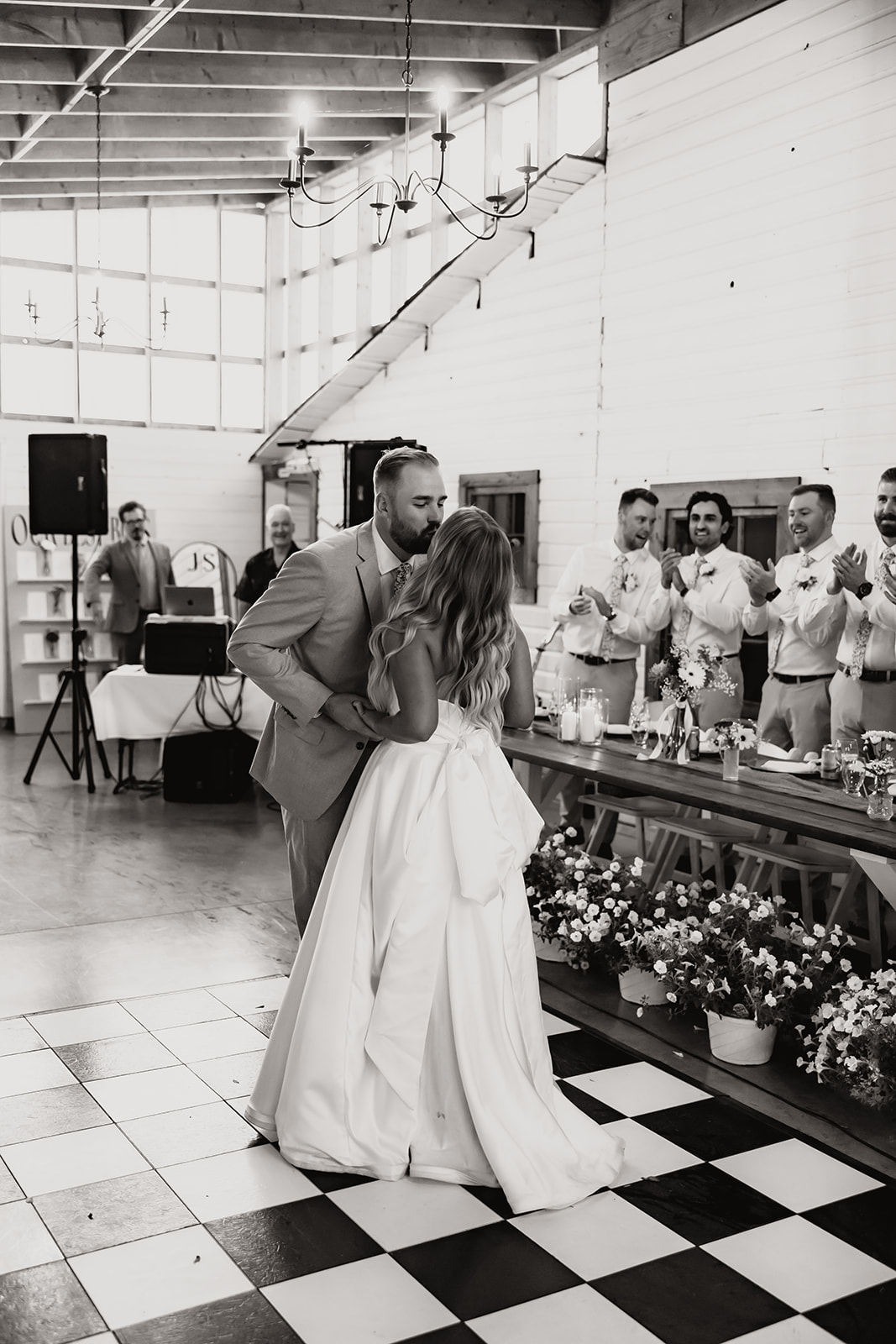 Bride and groom kissing during their wedding reception