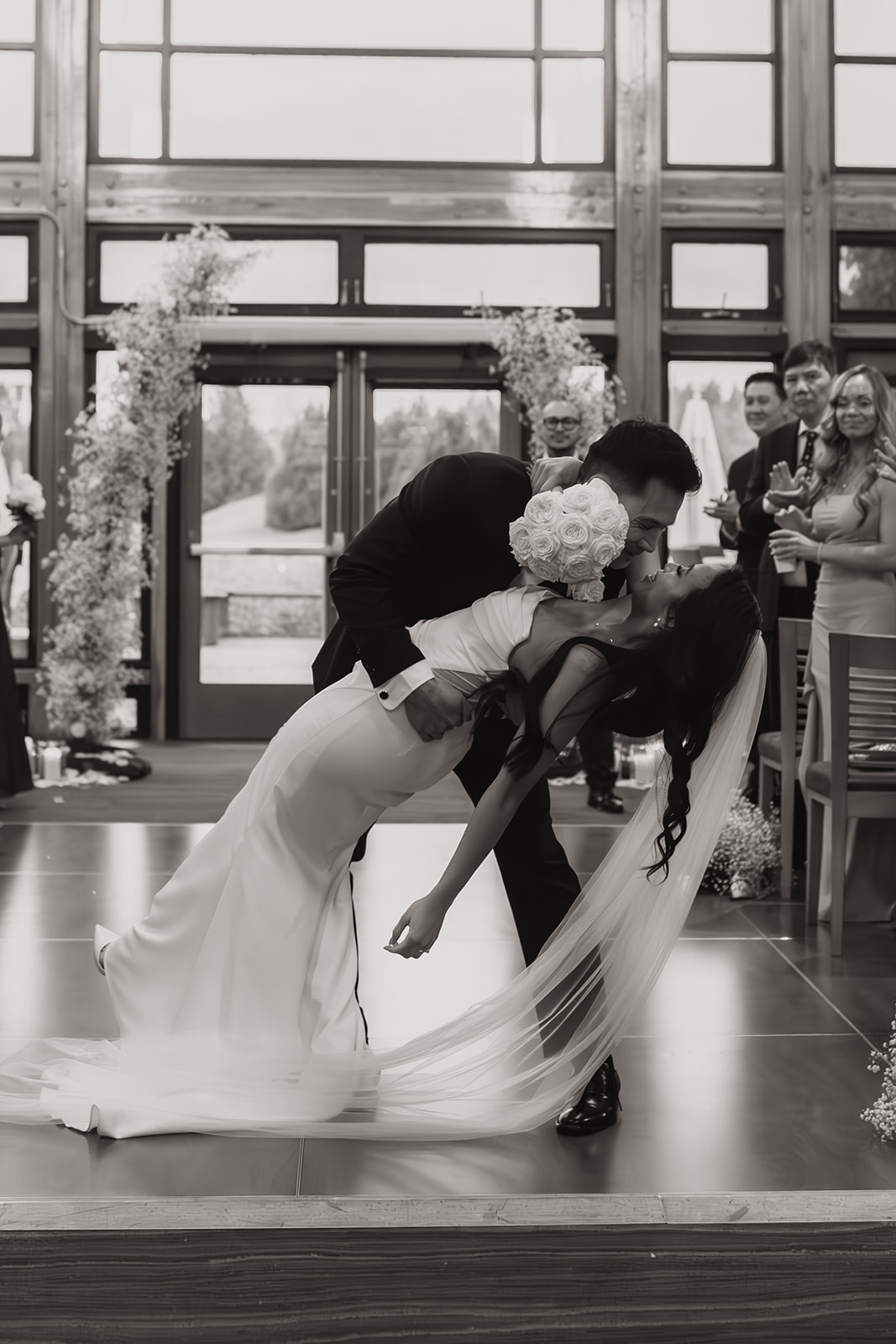 A joyful first kiss during the wedding ceremony, sealing the couple's vows and adding to the emotional moments captured throughout their wedding day timeline.