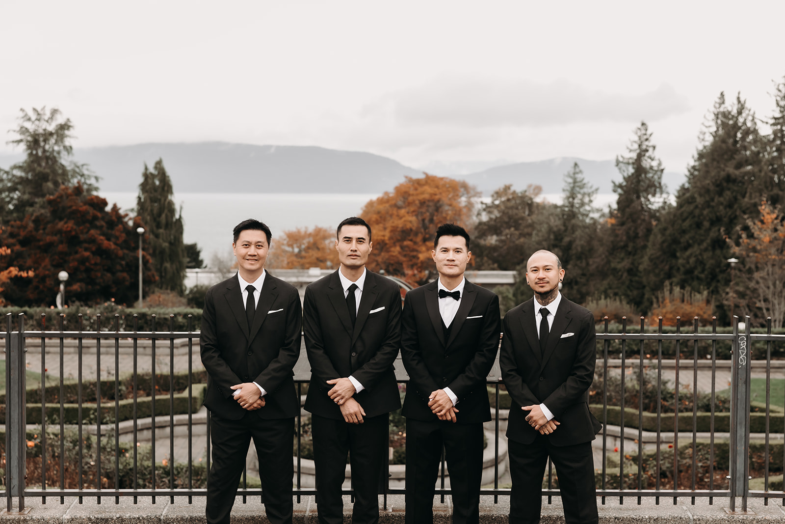 A group shot of the groom and his groomsmen at UBC Campus, posing for a fun moment within the structured wedding day timeline