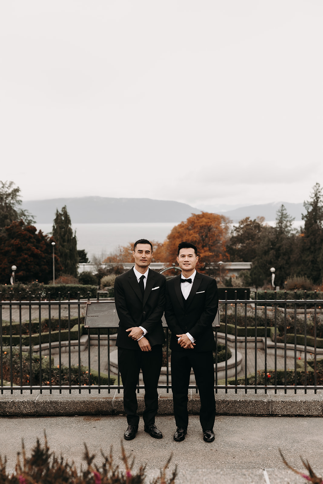 The groom and his groomsmen striking a playful pose, part of the laid-back vibe that couples can incorporate into their wedding day timeline to ensure fun moments.